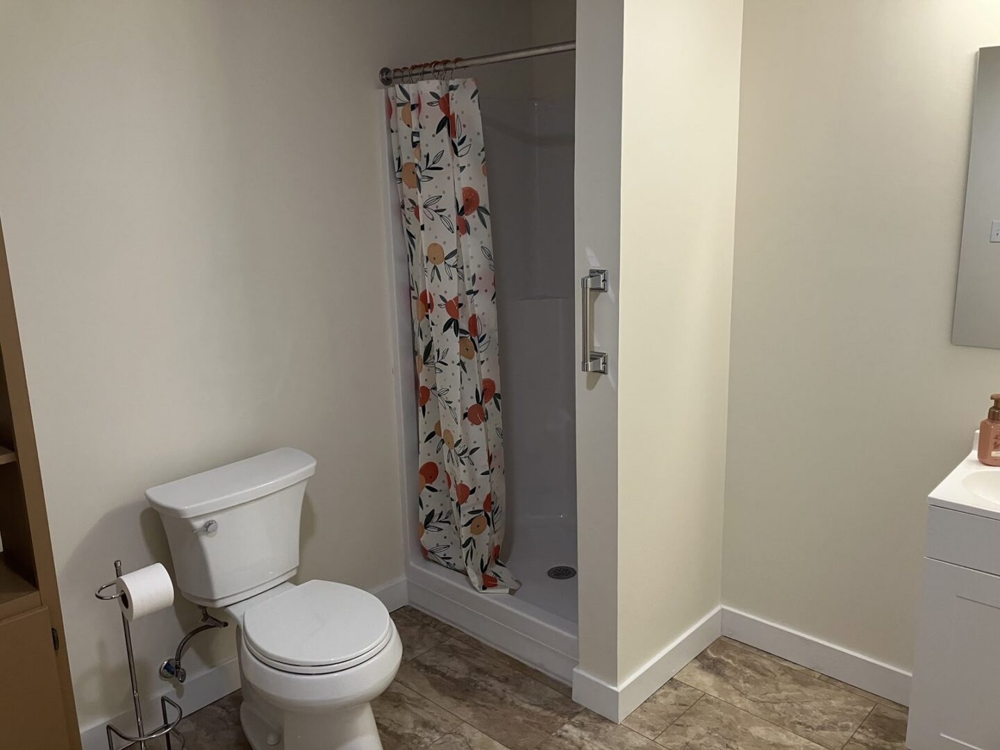 Finished bathroom with a toilet and shower