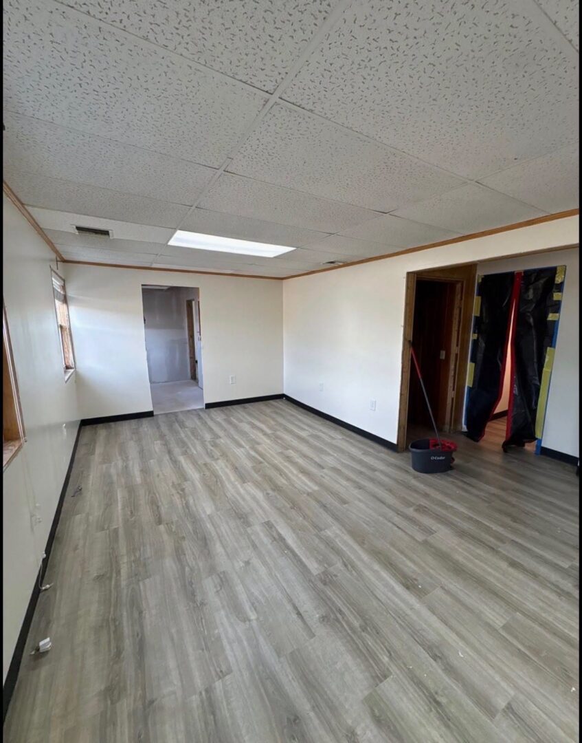 Renovated office room with new vinyl plank flooring
