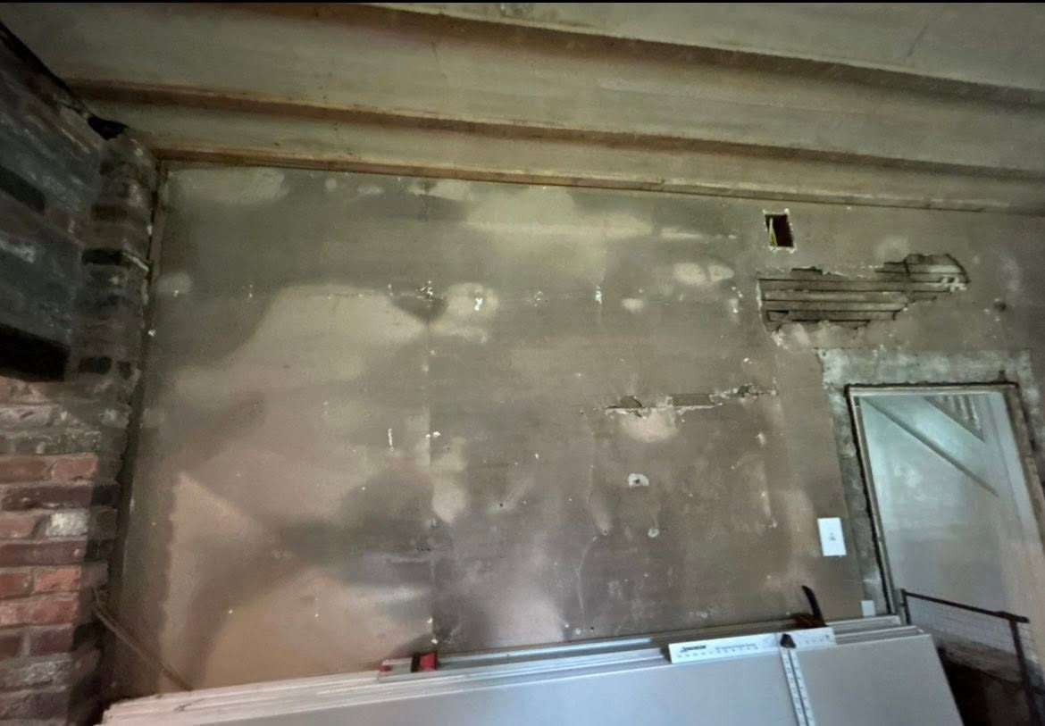 Room gutted to the studs and ceiling joists during a Red Ridge tear-out
