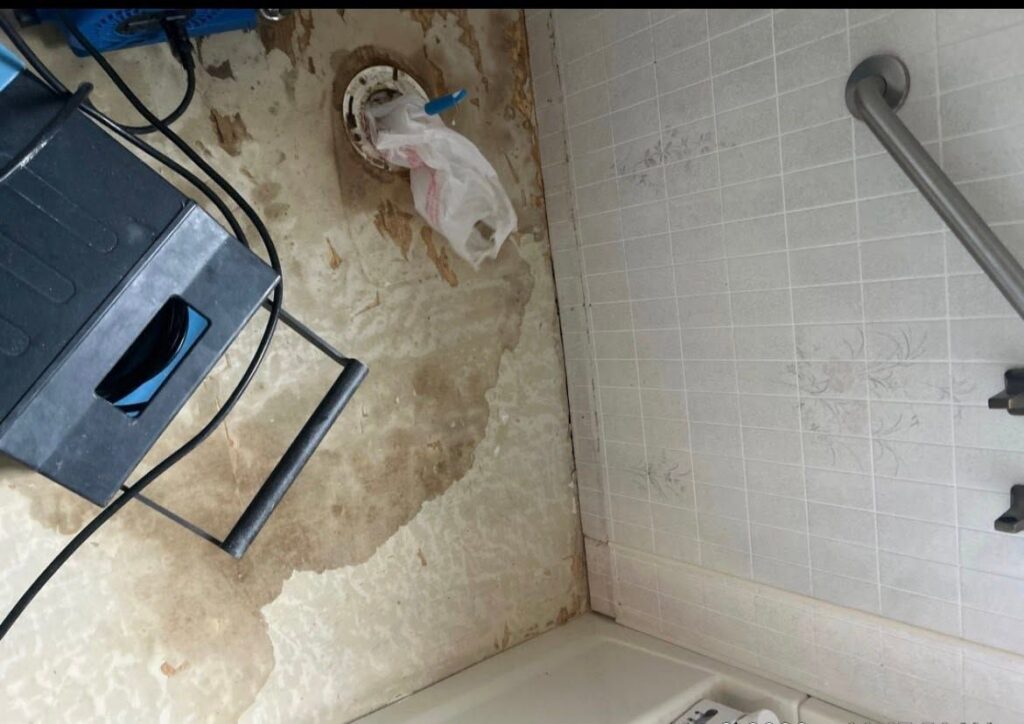 Drying equipment on a water-damaged bathroom floor during structural drying